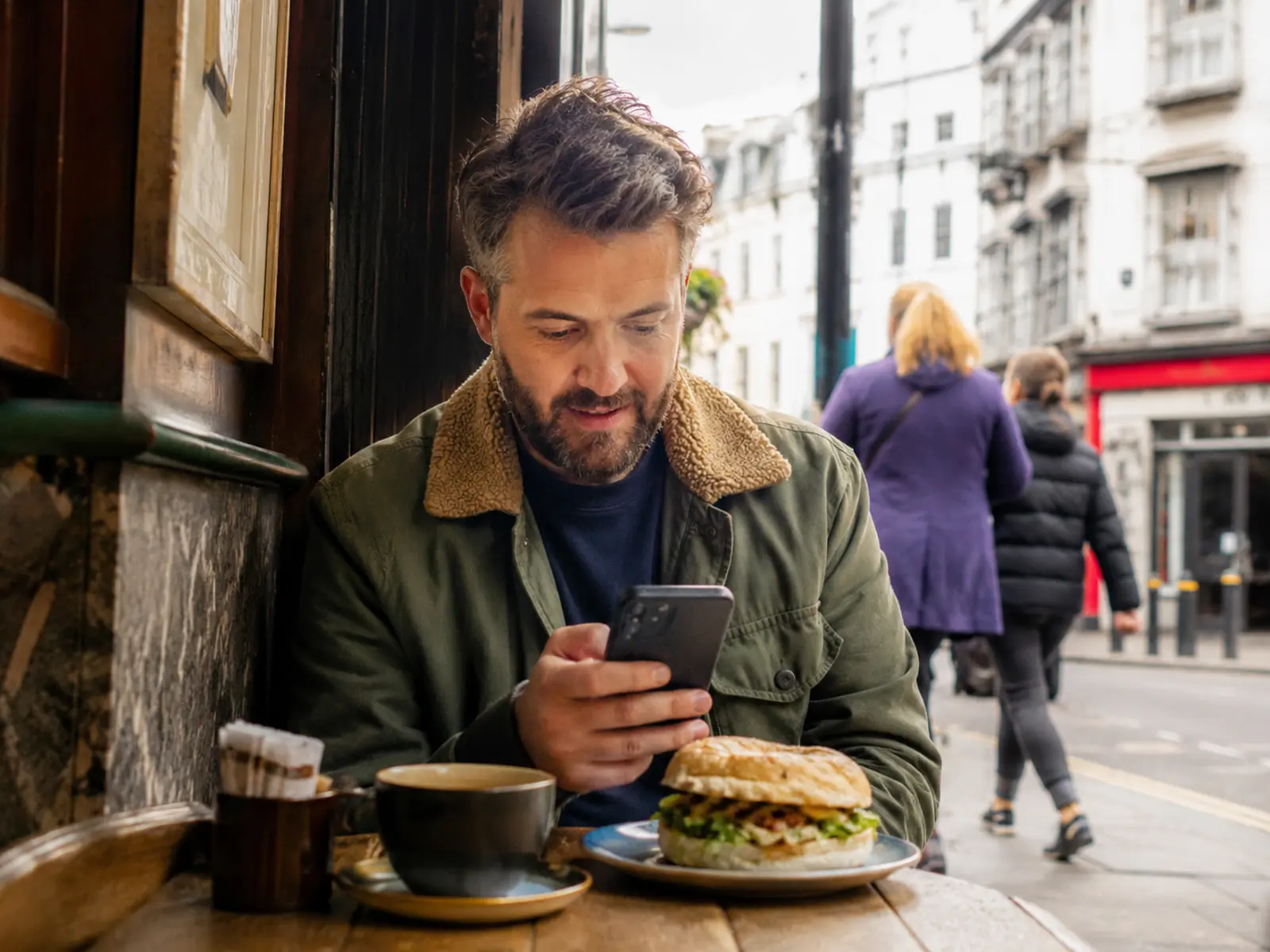 A customer placing a food order on their phone