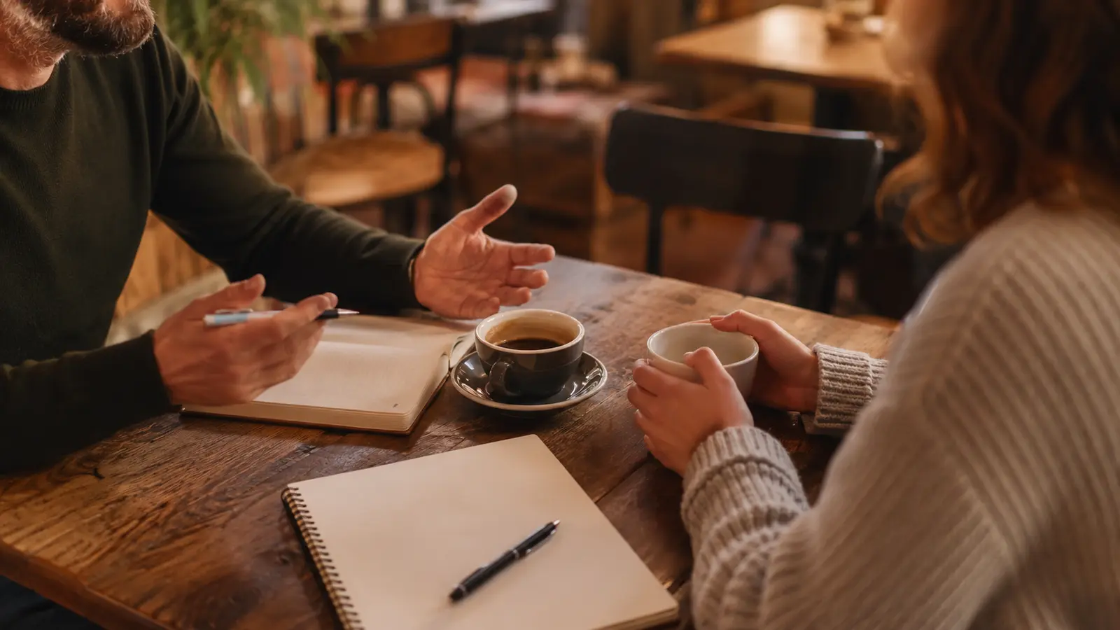 Meeting a client over coffee to plan a secure customer portal